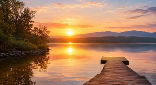 Peaceful lakeside sunrise reflecting calm waters, symbolizing comfort and remembrance for cremation services Tulsa, OK